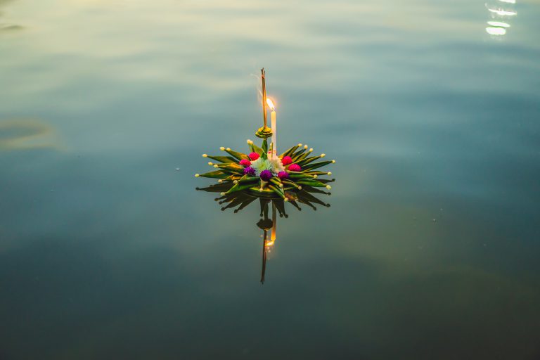 A krathong floating on the river during Loy Krathong in Nonthaburi,
