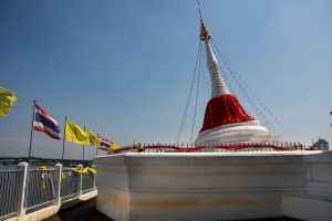 White leaning stupa with Thai flags at Wat Paramaiyikawat on Ko Kret Island